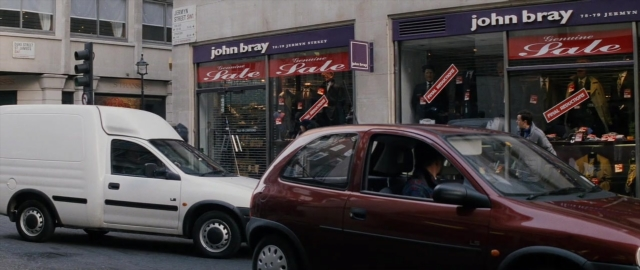 Frame from 101 Dalmatians — walking, street, car