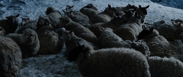 Wide shot frame from 101 Dalmatians — sheep, snow