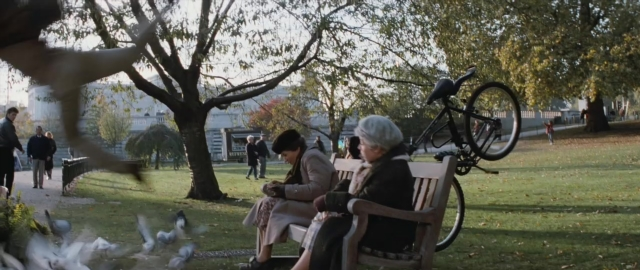 Wide shot frame from 101 Dalmatians — sitting, walking, dialogue