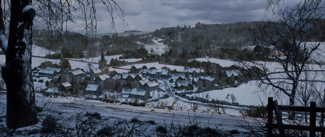 Wide shot frame from 101 Dalmatians — house, snow