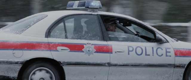 Frame from 101 Dalmatians — street, car, snow