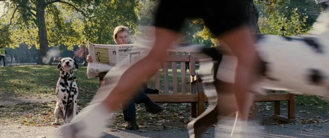 Wide shot frame from 101 Dalmatians — sitting, dog, newspaper