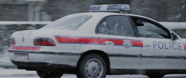 Frame from 101 Dalmatians — street, car, snow