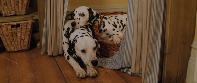 Wide shot frame from 101 Dalmatians — door, dog, picnic basket