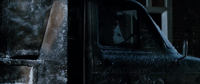 Wide shot frame from 101 Dalmatians — car, snow, window