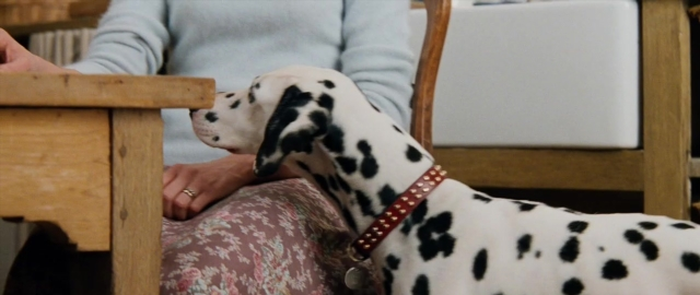 Frame from 101 Dalmatians — sitting, room, table