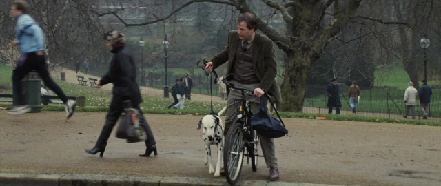 Frame from 101 Dalmatians — sitting, walking, street
