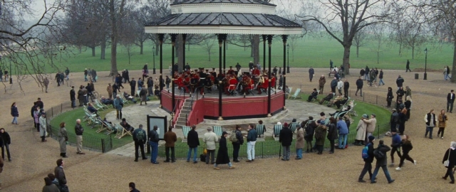 Wide shot frame from 101 Dalmatians — sitting, person