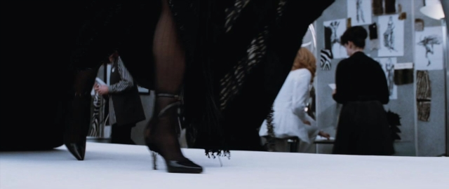Wide shot frame from 101 Dalmatians — standing, room, mirror