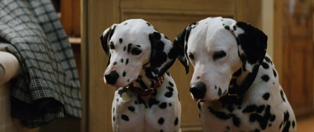 Medium shot frame from 101 Dalmatians — standing, room, door