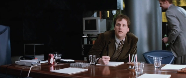 Wide shot frame from 101 Dalmatians — sitting, standing, room