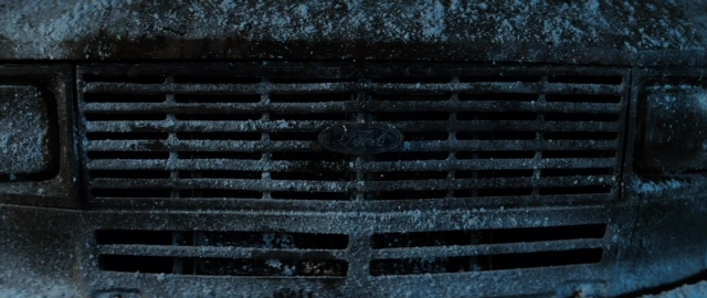 Wide shot frame from 101 Dalmatians — car, snow, land vehicle