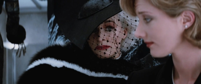 Medium shot frame from 101 Dalmatians — room, hat, face
