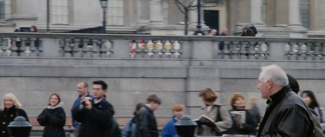 Wide shot frame from 101 Dalmatians — sitting, standing, walking