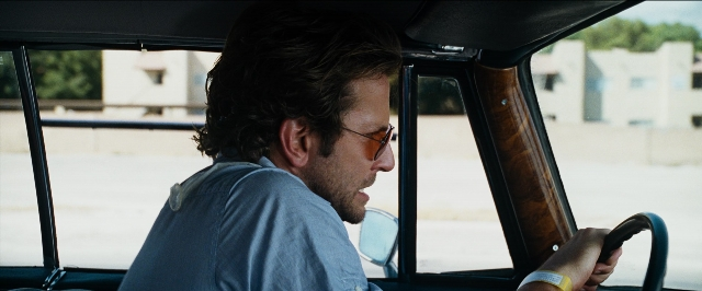 Wide shot frame from The Hangover — sitting, street, car