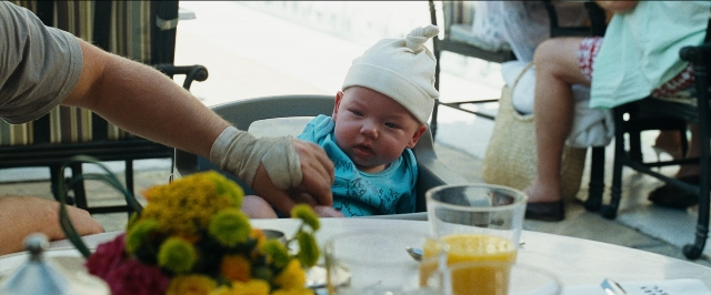 Frame from The Hangover — sitting, table, hat