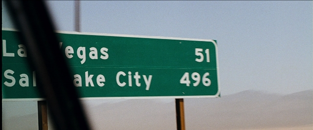 Wide shot frame from The Hangover — street, traffic sign