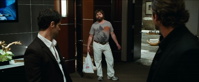 Wide shot frame from The Hangover — walking, room, dialogue