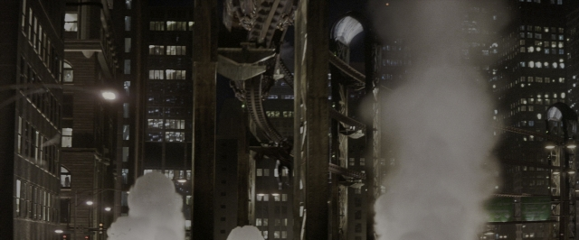 Wide shot frame from Batman Begins — night, water, smoke