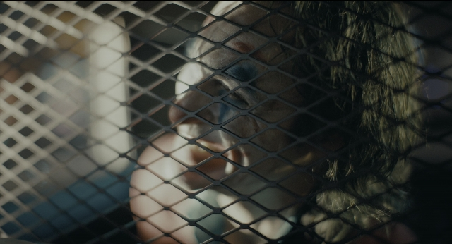 Wide shot frame from Joker — face, person, human face