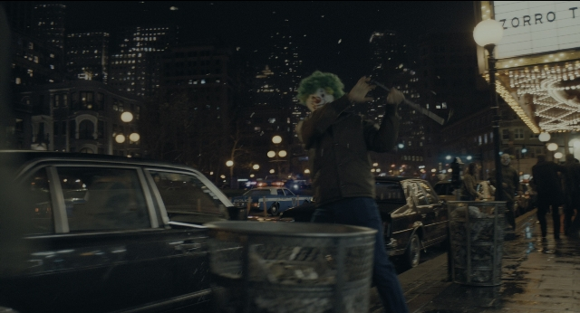 Wide shot frame from Joker — standing, walking, street