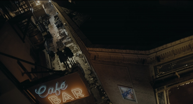 Wide shot frame from Joker — walking, street, night