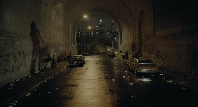 Wide shot frame from Joker — street, car, night