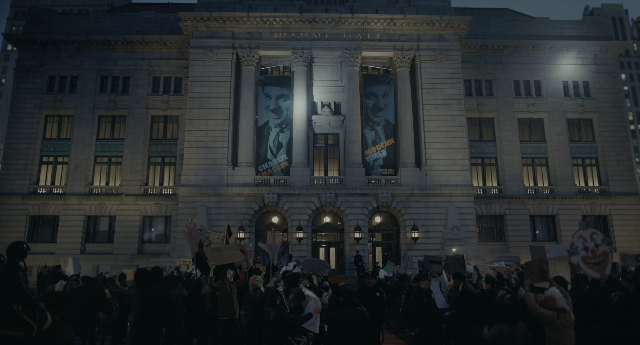 Wide shot frame from Joker — street, night, person