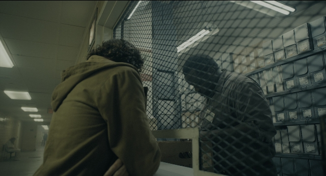 Wide shot frame from Joker — room, hair, person