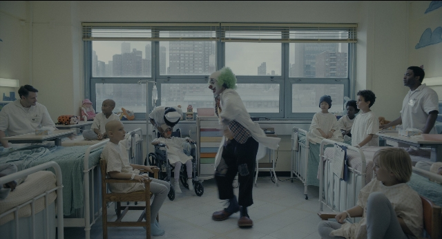 Wide shot frame from Joker — sitting, standing, walking