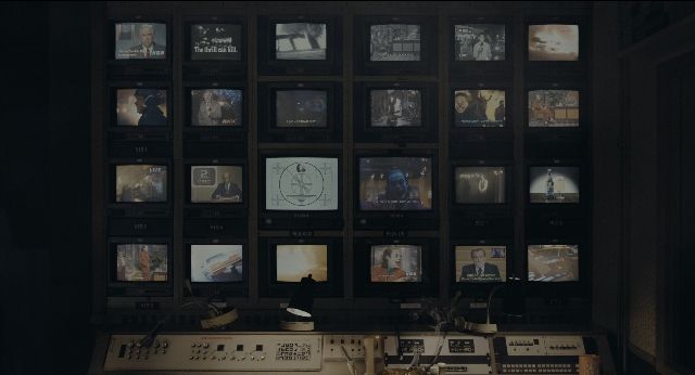 Wide shot frame from Joker — room, television, person