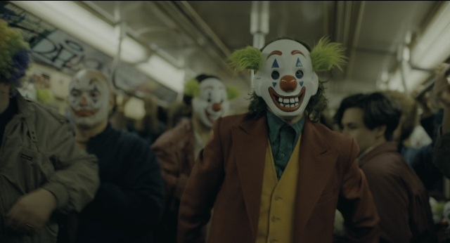 Wide shot frame from Joker — standing, walking, suit