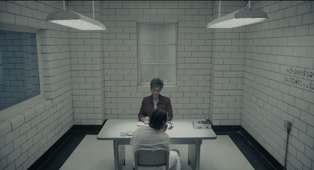 Frame from Joker — sitting, room, table