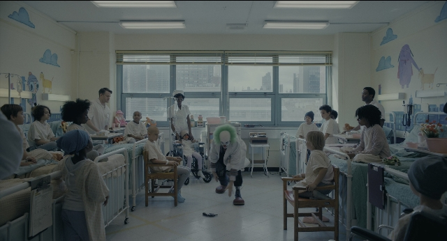 Wide shot frame from Joker — sitting, standing, walking