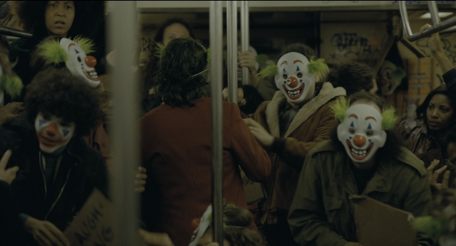 Wide shot frame from Joker — standing, train, person