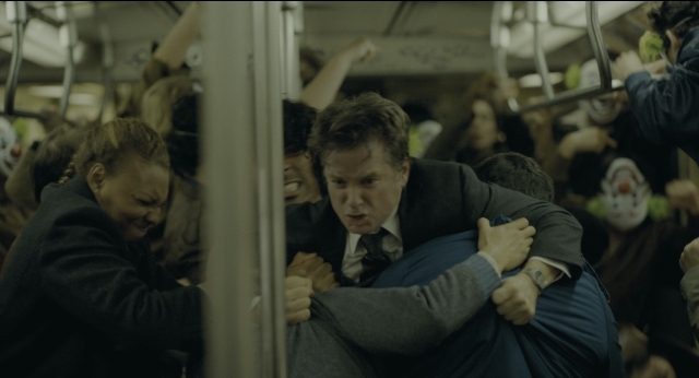 Medium shot frame from Joker — train, person, human face