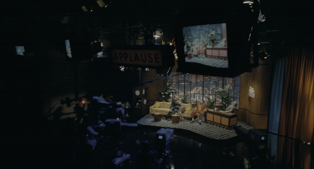 Wide shot frame from Joker — sitting, room, table