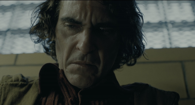 Close-up frame from Joker — face, hair, person