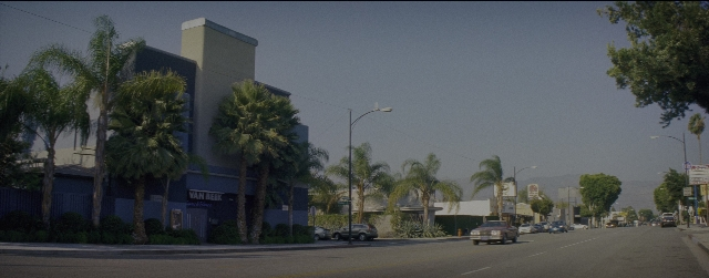 Wide shot frame from La La Land — street, office, building