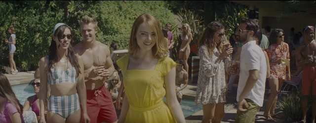 Wide shot frame from La La Land — walking, dress, hair