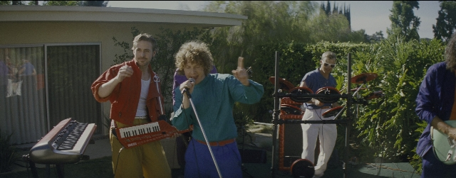 Wide shot frame from La La Land — standing, person, human face