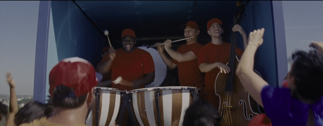 Wide shot frame from La La Land — drum, person, human face