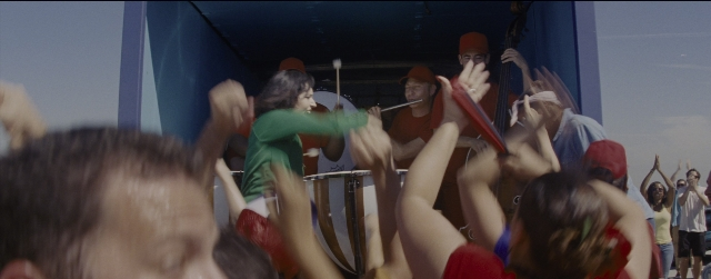 Wide shot frame from La La Land — hat, shirt, person