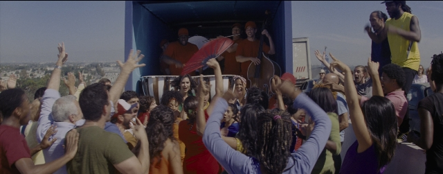 Wide shot frame from La La Land — standing, person, human face