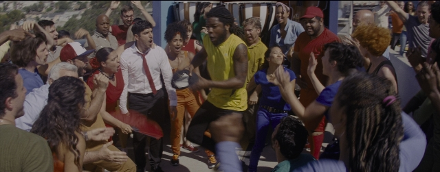 Wide shot frame from La La Land — street, shirt, person