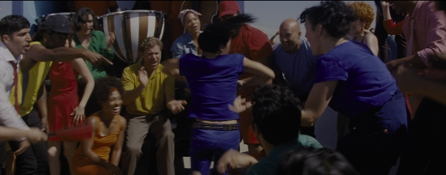 Wide shot frame from La La Land — room, hat, dress