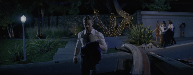 Wide shot frame from La La Land — standing, walking, street