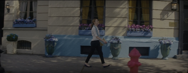 Wide shot frame from La La Land — walking, street, fire