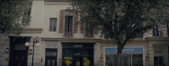 Wide shot frame from La La Land — door, street, lamp