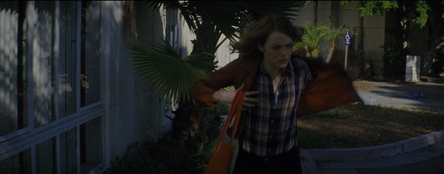 Wide shot frame from La La Land — walking, street, hand